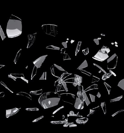 white glass shards scattered across black surface