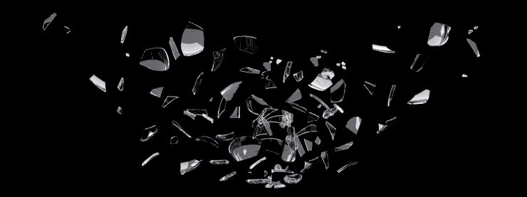 white glass shards scattered across black surface