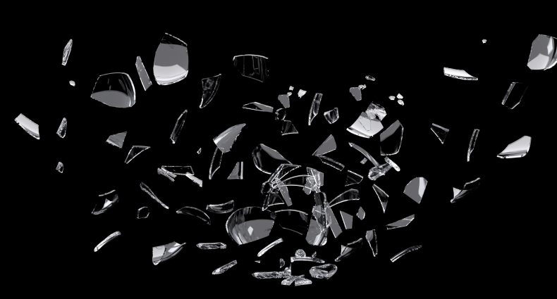 white glass shards scattered across black surface